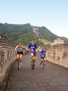 Nathan, Grace and Beau riding unicycles on the Great Wall of China, August
2000